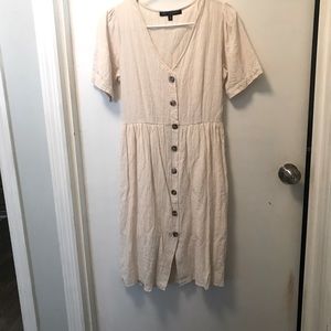 Knee length button up, lined off white coloured dress.